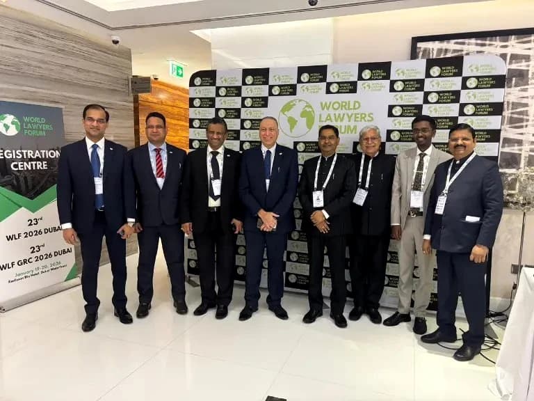 Delegates together in front of WLF branding at Dubai 2026