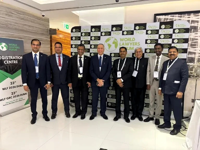 Delegates together in front of WLF branding at Dubai 2026